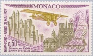 Colnect-147-964-Plane--quot-Ryan-quot--over-buildings-from-New-York-and-Paris.jpg