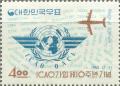 Colnect-2714-623-ICAO-emblem-and-plane.jpg