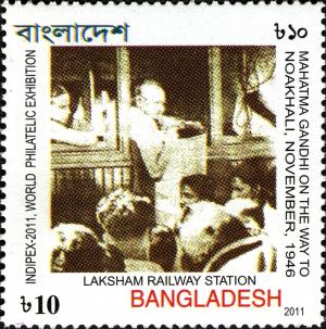 Colnect-2563-651-Gandhi-at-Laksham-Railway-Station-on-way-to-Noakhali.jpg