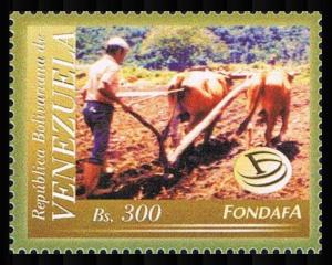 Colnect-5001-037-Farmer-plowing-field.jpg