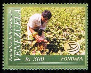 Colnect-5001-039-Farmer-tending-crops.jpg