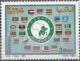 Colnect-1744-715-Emblem-surrounded-by-country-flags.jpg