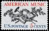 Colnect-3684-541-American-Music---Lute-Horn-Laurel-Oak-and-Music-Score.jpg