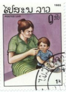 Colnect-1073-141-Mother-feeding-child.jpg