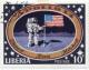 Colnect-1210-778-Astronauts-with-US-flag-on-moon.jpg