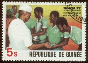 Colnect-2075-674-President-Toure-awarding-medals.jpg