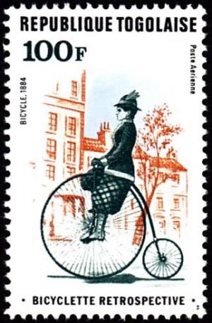 Colnect-6729-413-Woman-on-bicycle.jpg