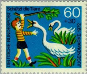 Colnect-152-808-Boy-annoying-swans.jpg