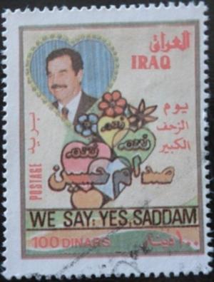 Colnect-1591-371-Saddam-Hussein-1937-2006-president--flowers-and-hearts.jpg