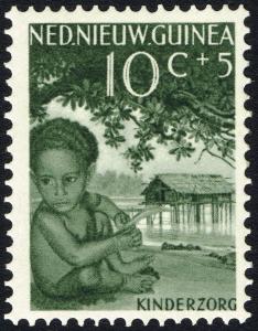 Colnect-2222-364-Papuan-boy-and-pile-dwelling.jpg