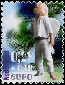 Colnect-667-605-Child-dressed-up-as-angel.jpg