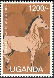 Colnect-2004-932-Tan-and-brown-horse-facing-right-with-two-feet-raised.jpg