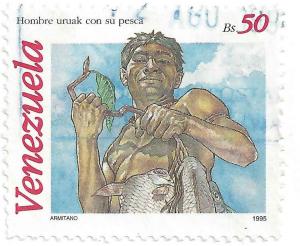 Colnect-3891-570-Uruak-man-with-caught-fish.jpg