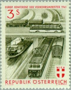 Colnect-136-463-Truck--amp--omnibus-on-bridge-over-trains-and-barges.jpg