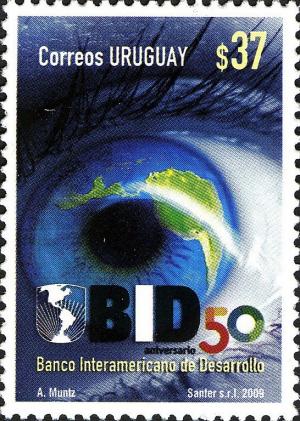 Colnect-2043-619-Eye-with-map-of-Suth-America-BID-Emblem.jpg