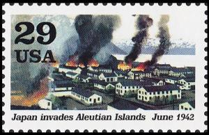 Colnect-5103-841-Dutch-harbor-buildings-on-fire-Japan-invades-Aleutian-Islan.jpg