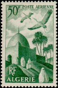 Colnect-697-077-White-storks-over-minaret.jpg