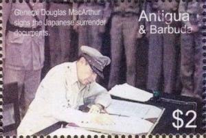 Colnect-3420-797-Gen-Douglas-MacArthur-signing-Japanese-surrender-documents.jpg