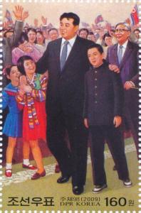 Colnect-3197-846-Kim-Il-Sung-with-repatriation-Koreans.jpg