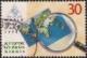 Colnect-1332-535-World-Post-Day--98---Continents-and-a-magnifying-glass.jpg